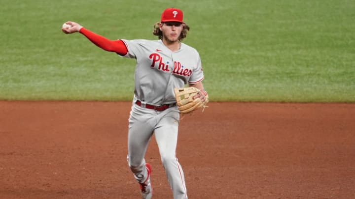 ST PETERSBURG, FLORIDA - SEPTEMBER 27: Alec Bohm #28 of the Philadelphia Phillies fields a ball from Yoshitomo Tsutsugo #25 of the Tampa Bay Rays (not pictured) during the eighth inning at Tropicana Field on September 27, 2020 in St Petersburg, Florida. (Photo by Douglas P. DeFelice/Getty Images)