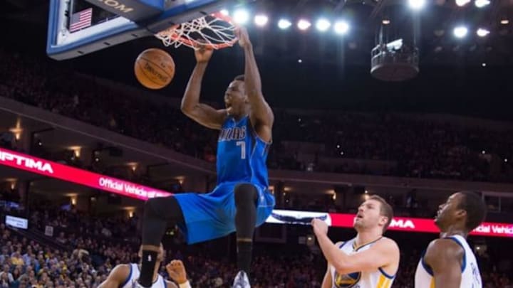 February 4, 2015; Oakland, CA, USA; Dallas Mavericks forward Al-Farouq Aminu (7) dunks the basketball against the Golden State Warriors during the first quarter at Oracle Arena. Mandatory Credit: Kyle Terada-USA TODAY Sports