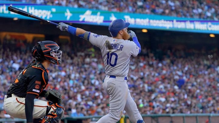 SAN FRANCISCO, CA - JUNE 08: Justin Turner #10 of the Los Angeles Dodgers hits a sacrifice fly scoring Kyle Garlick #41 against the San Francisco Giants in the top of the six inning of a Major League Baseball game at Oracle Park on June 8, 2019 in San Francisco, California. (Photo by Thearon W. Henderson/Getty Images)