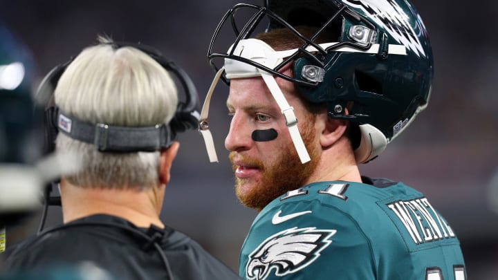 ARLINGTON, TEXAS – OCTOBER 20: Carson Wentz #11 of the Philadelphia Eagles talks to head coach Doug Pederson of the Philadelphia Eagles on the sidelines in a game against the Dallas Cowboys at AT&T Stadium on October 20, 2019 in Arlington, Texas. (Photo by Richard Rodriguez/Getty Images)