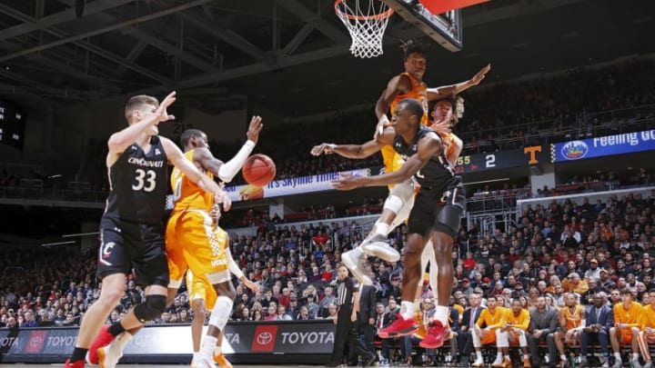 CINCINNATI, OH - DECEMBER 18: Keith Williams #2 of the Cincinnati Bearcats tries to pass under the basket while defended by Yves Pons #35 of the Tennessee Volunteers in the first half of the game at Fifth Third Arena on December 18, 2019 in Cincinnati, Ohio. (Photo by Joe Robbins/Getty Images)