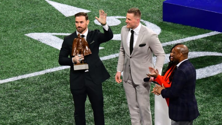 ATLANTA, GEORGIA - FEBRUARY 03: J.J. Watt of the Houston Texans presents the Walter Payton NFL Man of the Year trophy to Chris Long of the Philadelphia Eagles prior to Super Bowl LIII between the New England Patriots and the Los Angeles Rams at Mercedes-Benz Stadium on February 03, 2019 in Atlanta, Georgia. (Photo by Scott Cunningham/Getty Images)