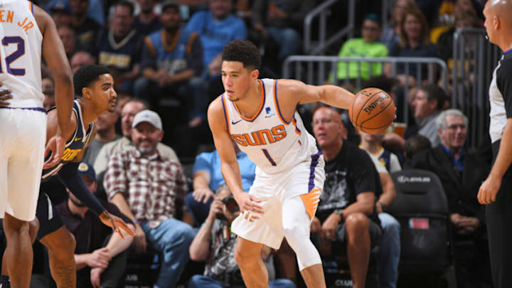 DENVER, CO - OCTOBER 20: Devin Booker #1 of the Phoenix Suns handles the ball against the Denver Nuggets on October 20, 2018 at the Pepsi Center in Denver, Colorado. NOTE TO USER: User expressly acknowledges and agrees that, by downloading and/or using this Photograph, user is consenting to the terms and conditions of the Getty Images License Agreement. Mandatory Copyright Notice: Copyright 2018 NBAE (Photo by Garrett Ellwood/NBAE via Getty Images)
