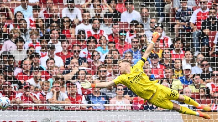 Arsenal's English goalkeeper Aaron Ramsdale dives for the ball during a club friendly football match between Arsenal and Sevilla at the Emirates Stadium in London on July 30, 2022. (Photo by JUSTIN TALLIS / AFP) (Photo by JUSTIN TALLIS/AFP via Getty Images)