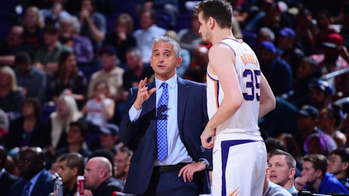 PHOENIX, AZ - MARCH 21: Head Coach Igor Kokoskov of the Phoenix Suns speaks with Dragan Bender #35 during the game against the Detroit Pistons on March 21, 2019 at Talking Stick Resort Arena in Phoenix, Arizona. NOTE TO USER: User expressly acknowledges and agrees that, by downloading and or using this photograph, user is consenting to the terms and conditions of the Getty Images License Agreement. Mandatory Copyright Notice: Copyright 2019 NBAE (Photo by Michael Gonzales/NBAE via Getty Images)