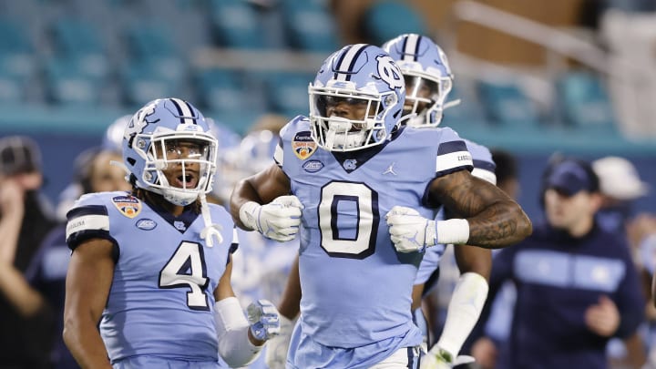 MIAMI GARDENS, FLORIDA – JANUARY 02: Ja’Qurious Conley #0 of the North Carolina Tar Heels celebrates after a tackle against the Texas A&M Aggies during the first half of the Capital One Orange Bowl at Hard Rock Stadium on January 02, 2021 in Miami Gardens, Florida. (Photo by Michael Reaves/Getty Images)