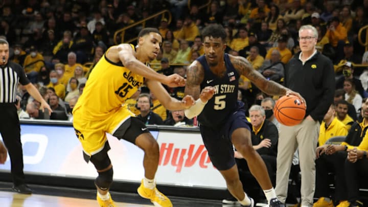 Jan 22, 2022; Iowa City, Iowa, USA; Penn State Nittany Lions forward Greg Lee (5) drives baseline against Iowa Hawkeyes forward Keegan Murray (15) at Carver-Hawkeye Arena. Mandatory Credit: Reese Strickland-USA TODAY Sports