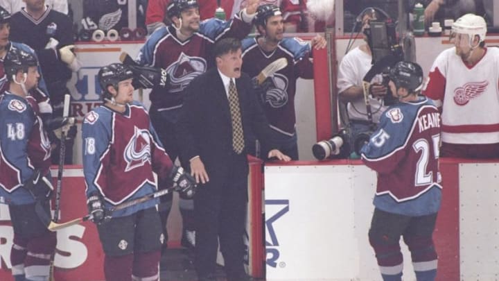 22 May 1997: Colorado Avalanche head coach Marc Crawford (center) yells during a playoff game against the Detroit Red Wings at Joe Louis Arena in Detroit, Michigan. The Red Wings won the game, 6-0. Mandatory Credit: Jason Wise /Allsport