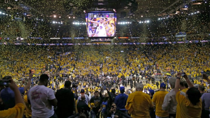 OAKLAND, CA - JUNE 12: Fans cheer as the Golden State Warriors celebrate after defeating the Cleveland Cavaliers 129-120 in Game 5 to win the 2017 NBA Finals at ORACLE Arena on June 12, 2017 in Oakland, California. NOTE TO USER: User expressly acknowledges and agrees that, by downloading and or using this photograph, User is consenting to the terms and conditions of the Getty Images License Agreement. (Photo by Ezra Shaw/Getty Images)