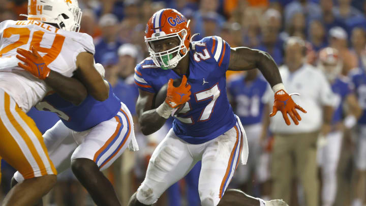 Sep 25, 2021; Gainesville, Florida, USA; Florida Gators running back Dameon Pierce (27) runs with the ball against the Tennessee Volunteers during the third quarter at Ben Hill Griffin Stadium. Mandatory Credit: Kim Klement-USA TODAY Sports