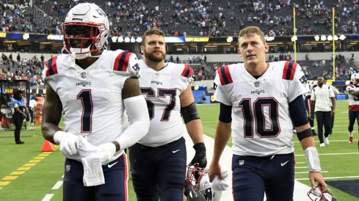 INGLEWOOD, CALIFORNIA - OCTOBER 31: N'Keal Harry #1, Ted Karras #67, and Mac Jones #10 of the New England Patriots walk off the field after the New England Patriots beat the Los Angeles Chargers 27-24 at SoFi Stadium on October 31, 2021 in Inglewood, California. (Photo by Kevork Djansezian/Getty Images)
