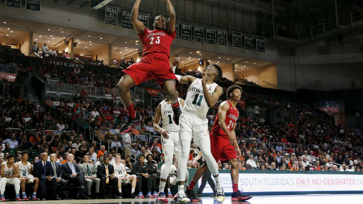 MIAMI, FLORIDA – NOVEMBER 05: Steven Enoch #23 of the Louisville Cardinals dunks against the Miami Hurricanes during the first half at Watsco Center on November 05, 2019 in Miami, Florida. (Photo by Michael Reaves/Getty Images)