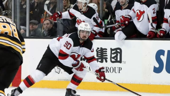 BOSTON, MA - JANUARY 23: New Jersey Devils winger Marcus Johansson (90) looks to pass as he gains the blue line during a game between the Boston Bruins and the New Jersey Devils on January 23, 2018, at TD Garden in Boston, Massachusetts. The Bruins defeated the Devils 3-2. (Photo by Fred Kfoury III/Icon Sportswire via Getty Images)