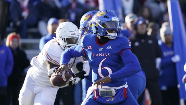 LAWRENCE, KANSAS – NOVEMBER 19: Quarterback Jalon Daniels #6 of the Kansas Jayhawks passes in the first half against the Texas Longhorns at David Booth Kansas Memorial Stadium on November 19, 2022 in Lawrence, Kansas. (Photo by Ed Zurga/Getty Images)