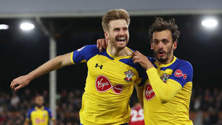 LONDON, ENGLAND - NOVEMBER 24: Stuart Armstrong of Southampton celebrates with teammate Manolo Gabbiadini after scoring his team's second goal during the Premier League match between Fulham FC and Southampton FC at Craven Cottage on November 24, 2018 in London, United Kingdom. (Photo by Christopher Lee/Getty Images)