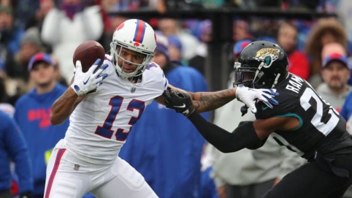 BUFFALO, NY - NOVEMBER 25: Kelvin Benjamin #13 of the Buffalo Bills bobbles a pass but manages to recover and hold on to the ball for the reception in the first quarter during NFL game action as Jalen Ramsey #20 of the Jacksonville Jaguars defends at New Era Field on November 25, 2018 in Buffalo, New York. (Photo by Tom Szczerbowski/Getty Images)