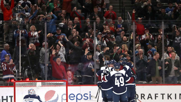 DENVER, COLORADO - FEBRUARY 20: Members of the Colorado Avalanche celebrate a goal against the Winnipeg Jets in the third period at the Pepsi Center on February 20, 2019 in Denver, Colorado. (Photo by Matthew Stockman/Getty Images)