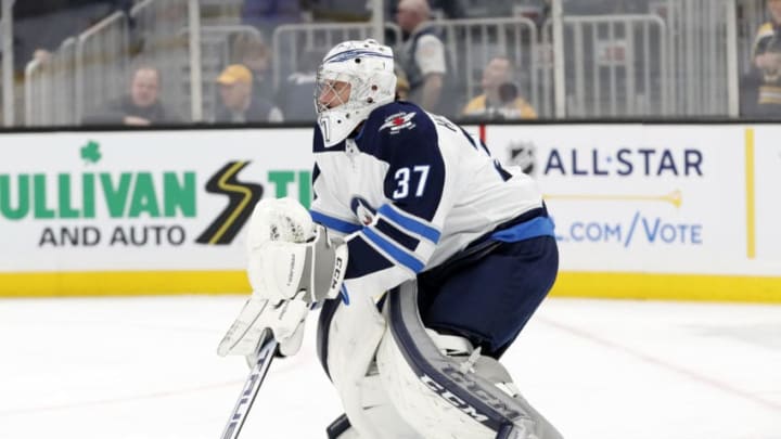 BOSTON, MA - JANUARY 09: Winnipeg Jets goalie Connor Hellebuyck (37) takes shots in warm up before a game between the Boston Bruins and the Winnipeg Jets on January 9, 2020, at TD Garden in Boston, Massachusetts. (Photo by Fred Kfoury III/Icon Sportswire via Getty Images)