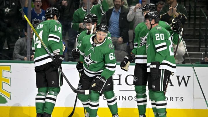 Feb 27, 2023; Dallas, Texas, USA; Dallas Stars right wing Evgenii Dadonov (63) and center Wyatt Johnston (53) and defenseman Jani Hakanpaa (2) and left wing Jamie Benn (14) and defenseman Ryan Suter (20) celebrates a goal scored by Dadonov against the Vancouver Canucks during the second period at the American Airlines Center. Mandatory Credit: Jerome Miron-USA TODAY Sports