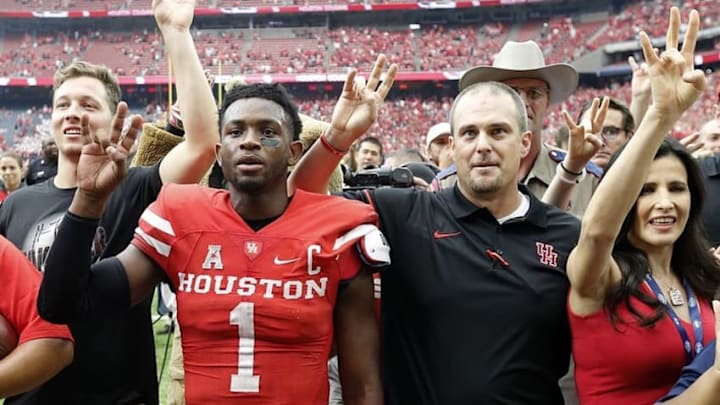 Sep 3, 2016; Houston, TX, USA; Houston Cougars quarterback Greg Ward Jr. (1) and head coach Tom Herman celebrate dealing the Oklahoma Sooners in the second half at NRG Stadium. Houston Cougars won 33 to 23. Mandatory Credit: Thomas B. Shea-USA TODAY Sports