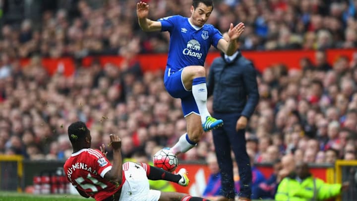MANCHESTER, ENGLAND - APRIL 03: Timothy Fosu-Mensah of Manchester United tackles Leighton Baines of Everton during the Barclays Premier League match between Manchester United and Everton at Old Trafford on April 3, 2016 in Manchester, England. (Photo by Shaun Botterill/Getty Images)