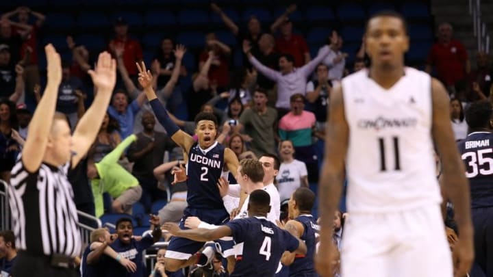 Mar 11, 2016; Orlando, FL, USA; Connecticut Huskies guard Jalen Adams (2) celebrates after a half court shot to send them them into a fourth overtime against the Cincinnati Bearcats during the AAC Tournament at the Amway Center. The Connecticut Huskies won 104-97. Mandatory Credit: Logan Bowles-USA TODAY Sports
