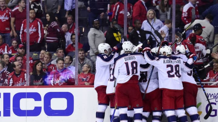 WASHINGTON, DC - APRIL 12: Artemi Panarin #9 of the Columbus Blue Jackets celebrates with his teammates after scoring the game-winning goal in overtime against the Washington Capitals in Game One of the Eastern Conference First Round during the 2018 NHL Stanley Cup Playoffs at Capital One Arena on April 12, 2018 in Washington, DC. (Photo by Patrick McDermott/NHLI via Getty Images)
