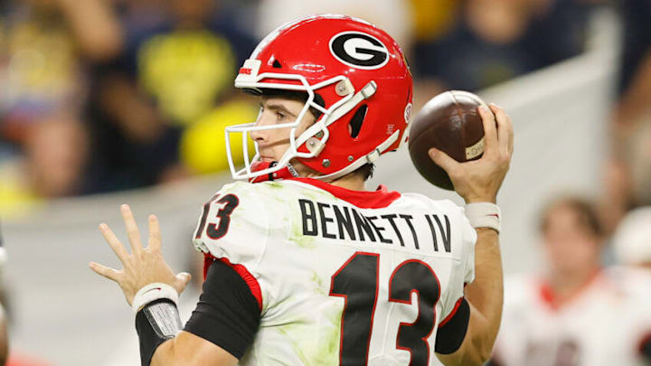 MIAMI GARDENS, FLORIDA - DECEMBER 31: Stetson Bennett #13 of the Georgia Bulldogs in action against the Michigan Wolverines in the Capital One Orange Bowl for the College Football Playoff semifinal game at Hard Rock Stadium on December 31, 2021 in Miami Gardens, Florida. (Photo by Michael Reaves/Getty Images)