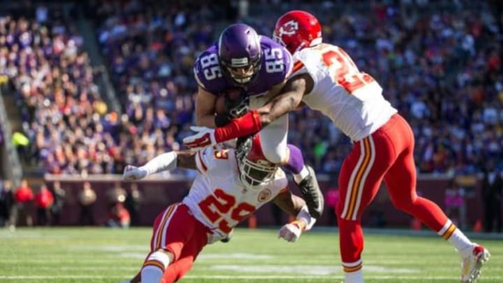 Oct 18, 2015; Minneapolis, MN, USA; Minnesota Vikings tight end Rhett Ellison (85) carries the ball as Kansas City Chiefs safety Eric Berry (29) and cornerback Sean Smith (21) tackle during the second quarter at TCF Bank Stadium. Mandatory Credit: Brace Hemmelgarn-USA TODAY Sports