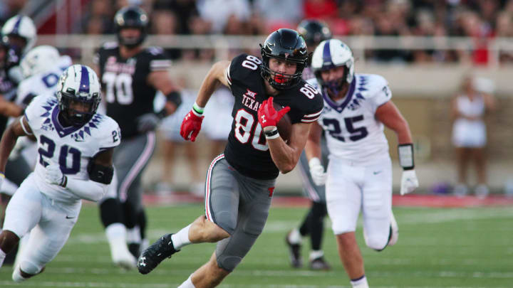 Oct 9, 2021; Lubbock, Texas, USA; Texas Tech Red Raiders tight end Mason Tharp (80) rushes against the Texas Christian Horned Frogs in the first half at Jones AT&T Stadium. Mandatory Credit: Michael C. Johnson-USA TODAY Sports