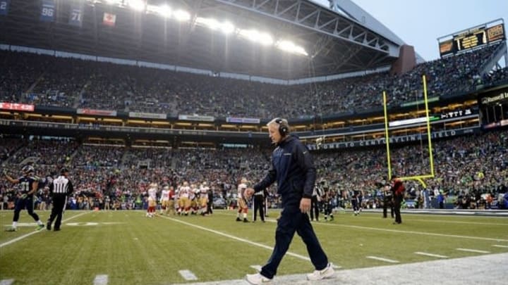 Jan 19, 2014; Seattle, WA, USA; Seattle Seahawks head coach Pete Carroll walks the sideline during the first half of the 2013 NFC Championship football game against the San Francisco 49ers at CenturyLink Field. Mandatory Credit: Kyle Terada-USA TODAY Sports