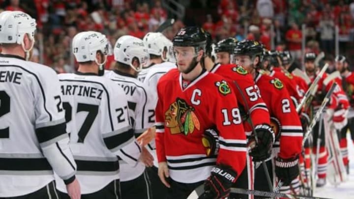 Jun 1, 2014; Chicago, IL, USA; Chicago Blackhawks center Jonathan Toews (19) shakes hands with Los Angeles Kings defenseman Alec Martinez (27) after game seven of the Western Conference Final of the 2014 Stanley Cup Playoffs at United Center. Mandatory Credit: Jerry Lai-USA TODAY Sports