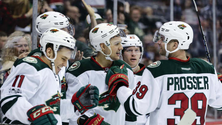 Apr 6, 2017; Denver, CO, USA; Minnesota Wild right wing Nino Niederreiter (22) celebrates with defenseman Nate Prosser (39) and center Eric Staal (12) and left wing Zach Parise (11) after his goal in the third period against the Colorado Avalanche at the Pepsi Center. The Wild won 4-3. Mandatory Credit: Isaiah J. Downing-USA TODAY Sports