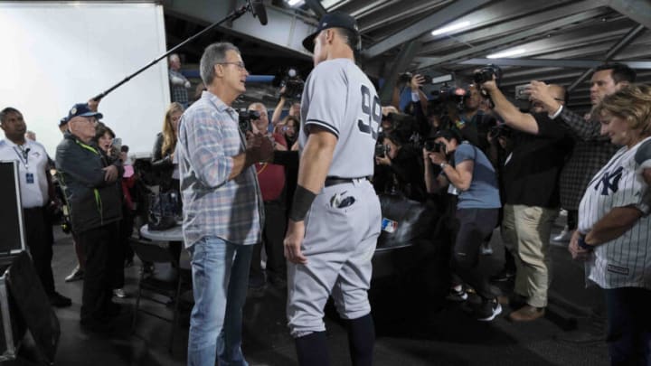 Sep 28, 2022; Toronto, Ontario, CAN; New York Yankees designated hitter Aaron Judge (99) shakes hands with Roger E. Maris Jr. at the end of the game against the Toronto Blue Jays at Rogers Centre. Mandatory Credit: Nick Turchiaro-USA TODAY Sports