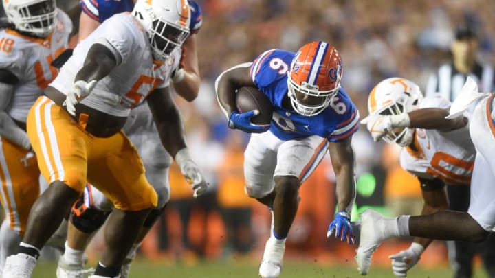 Florida running back Nay’Quan Wright (6) escapes Tennessee defense during an NCAA football game against Florida at Ben Hill Griffin Stadium in Gainesville, Florida on Saturday, Sept. 25, 2021.Tennflorida0925 1611