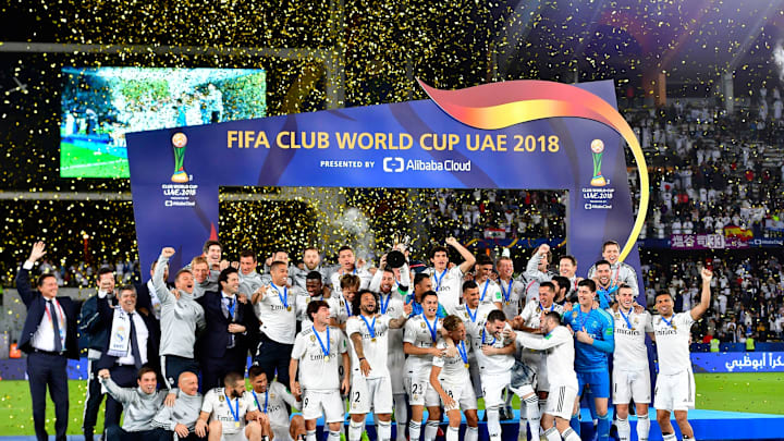 Real Madrid’s players celebrate with the trophy after winning the FIFA Club World Cup final football match Spain’s Real Madrid vs Abu Dhabi’s Al Ain at the Zayed Sports City Stadium in Abu Dhabi, the capital of the United Arab Emirates, on December 22, 2018. (Photo by Giuseppe CACACE / AFP) (Photo credit should read GIUSEPPE CACACE/AFP/Getty Images)