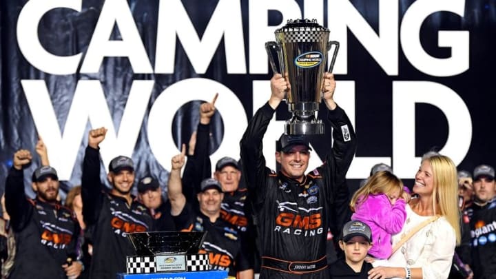 Nov 18, 2016; Homestead, FL, USA; NASCAR Camping World Truck Series driver Johnny Sauter (21) celebrates winning NASCAR Camping World Truck Series championship during the Ford Ecoboost 200 at Homestead-Miami Speedway. Mandatory Credit: Jasen Vinlove-USA TODAY Sports