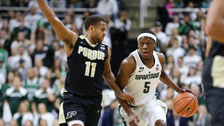 EAST LANSING, MI – FEBRUARY 10: Cassius Winston #5 of the Michigan State Spartans handles the ball while defended by P.J. Thompson #11 of the Purdue Boilermakers at Breslin Center on February 10, 2018 in East Lansing, Michigan. (Photo by Rey Del Rio/Getty Images)