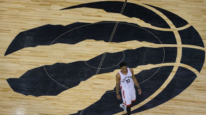 TORONTO, ON - MAY 7: Toronto Raptors guard DeMar DeRozan (10) walks across the team logo at centre court as time runs out. Toronto Raptors vs Cleveland Cavaliers in 2nd round action of NBA playoffs at Air Canada Centre. Raptors are swept 4-0 in games with a loss today 109-102. Toronto Star/Rick Madonik (Rick Madonik/Toronto Star via Getty Images)