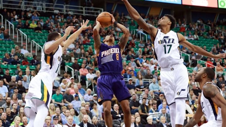 Oct 12, 2016; Salt Lake City, UT, USA; Utah Jazz guard Quincy Ford (17) tries to block the shot of Phoenix Suns guard Tyler Ulis (8) during the fourth quarter at Vivint Smart Home Arena. Phoenix Suns beat the Utah Jazz 111-110. Mandatory Credit: Chris Nicoll-USA TODAY Sports