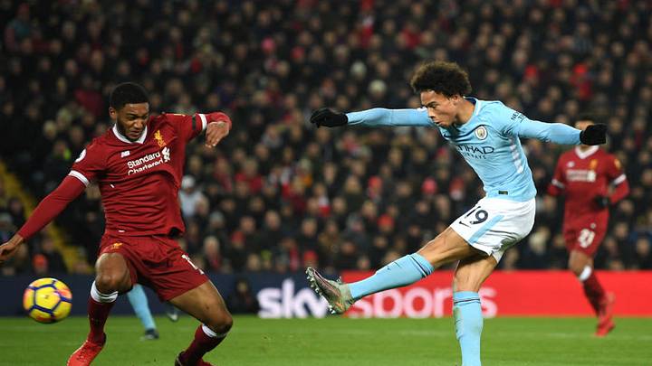 LIVERPOOL, ENGLAND - JANUARY 14: Leroy Sane of Manchester City scores the first Manchester City goal during the Premier League match between Liverpool and Manchester City at Anfield on January 14, 2018 in Liverpool, England. (Photo by Shaun Botterill/Getty Images)