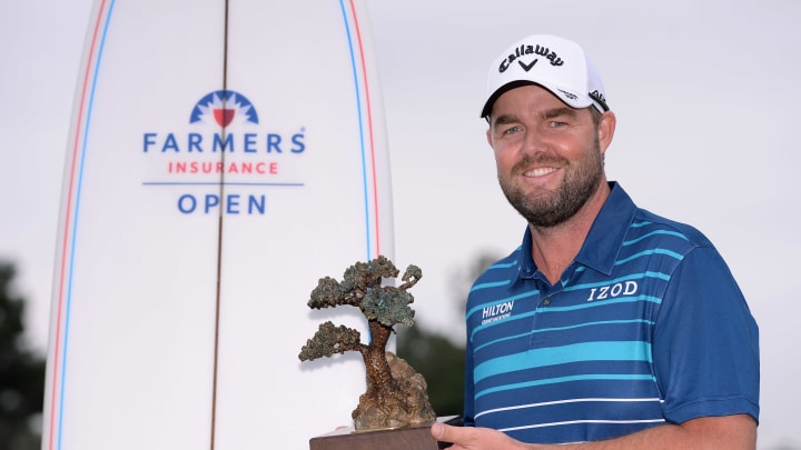 Jan 26, 2020; San Diego, California, USA; Marc Leishman poses with the winner’s trophy following the final round of the Farmers Insurance Open golf tournament at Torrey Pines Municipal Golf Course – South Co. Mandatory Credit: Orlando Ramirez-USA TODAY Sports