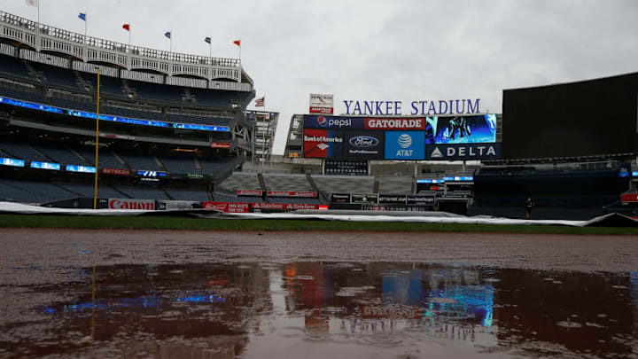 NEW YORK, NY - AUGUST 29: Rain puddles up on the warning track as the game between the Cleveland Indians and New York Yankees has been postponed due to rain at Yankee Stadium on August 29, 2017 in the Bronx borough of New York City. (Photo by Rich Schultz/Getty Images)