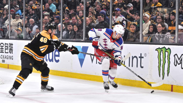 BOSTON, MA – JANUARY 19: New York Rangers Right Wing Pavel Buchnevich (89) tries to get to the puck before Boston Bruins Defenceman Matt Grzelcyk (48). During the New York Rangers game against the Boston Bruins on January 19, 2019 at TD Garden in Boston, MA. (Photo by Michael Tureski/Icon Sportswire via Getty Images)