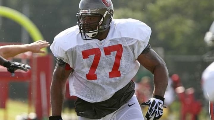 August 3, 2012; Tampa, FL, USA; Tampa Bay Buccaneers offensive guard Carl Nicks (77) blocks during training camp at One Buc Place. Mandatory Credit: Kim Klement-USA TODAY Sports