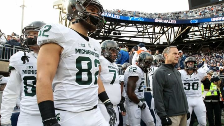 Nov 26, 2016; University Park, PA, USA; Michigan State Spartans head coach Mark Dantonio with his team prior to the game against the Penn State Nittany Lions at Beaver Stadium. Penn State defeated Michigan State 45-12. Mandatory Credit: Matthew O
