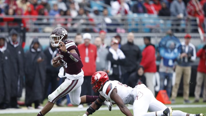 JACKSONVILLE, FL – DECEMBER 30: Keytaon Thompson #10 of the Mississippi State Bulldogs runs the ball in the first half of the TaxSlayer Bowl against the Louisville Cardinals at EverBank Field on December 30, 2017 in Jacksonville, Florida. (Photo by Joe Robbins/Getty Images)