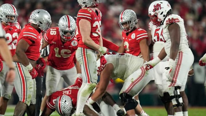 Ohio State Buckeyes linebacker Tommy Eichenberg (35) celebrates a tackle on Utah Utes running back Tavion Thomas (9) during the fourth quarter of the Rose Bowl in Pasadena, Calif. on Jan. 1, 2022.College Football Rose Bowl
