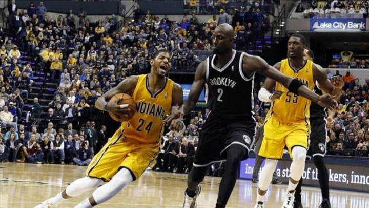 Feb 1, 2014; Indianapolis, IN, USA; Indiana Pacers forward Paul George (24) drives to the basket against Brooklyn Nets center Kevin Garnett (2) at Bankers Life Fieldhouse. Indiana defeats Brooklyn 97-96. Mandatory Credit: Brian Spurlock-USA TODAY Sports