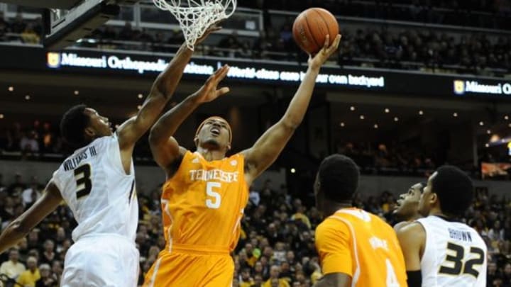Feb 15, 2014; Columbia, MO, USA; Tennessee Volunteers forward Jarnell Stokes (5) goes for a basket as Missouri Tigers forward Johnathan Williams, III (3) blocks during the first half at Mizzou Arena. Mandatory Credit: Dak Dillon-USA TODAY Sports